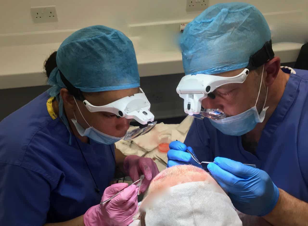 Our surgeons performing a hair transplant procedure